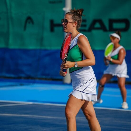 A group tennis lesson on court.